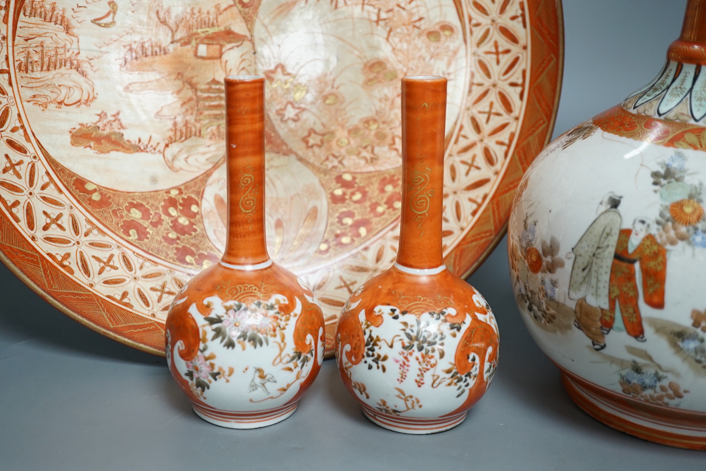 A 19th century Kutani bottle vase, a pair of smaller, similar vases and a large dish (4). Bottle vase 31cms high.